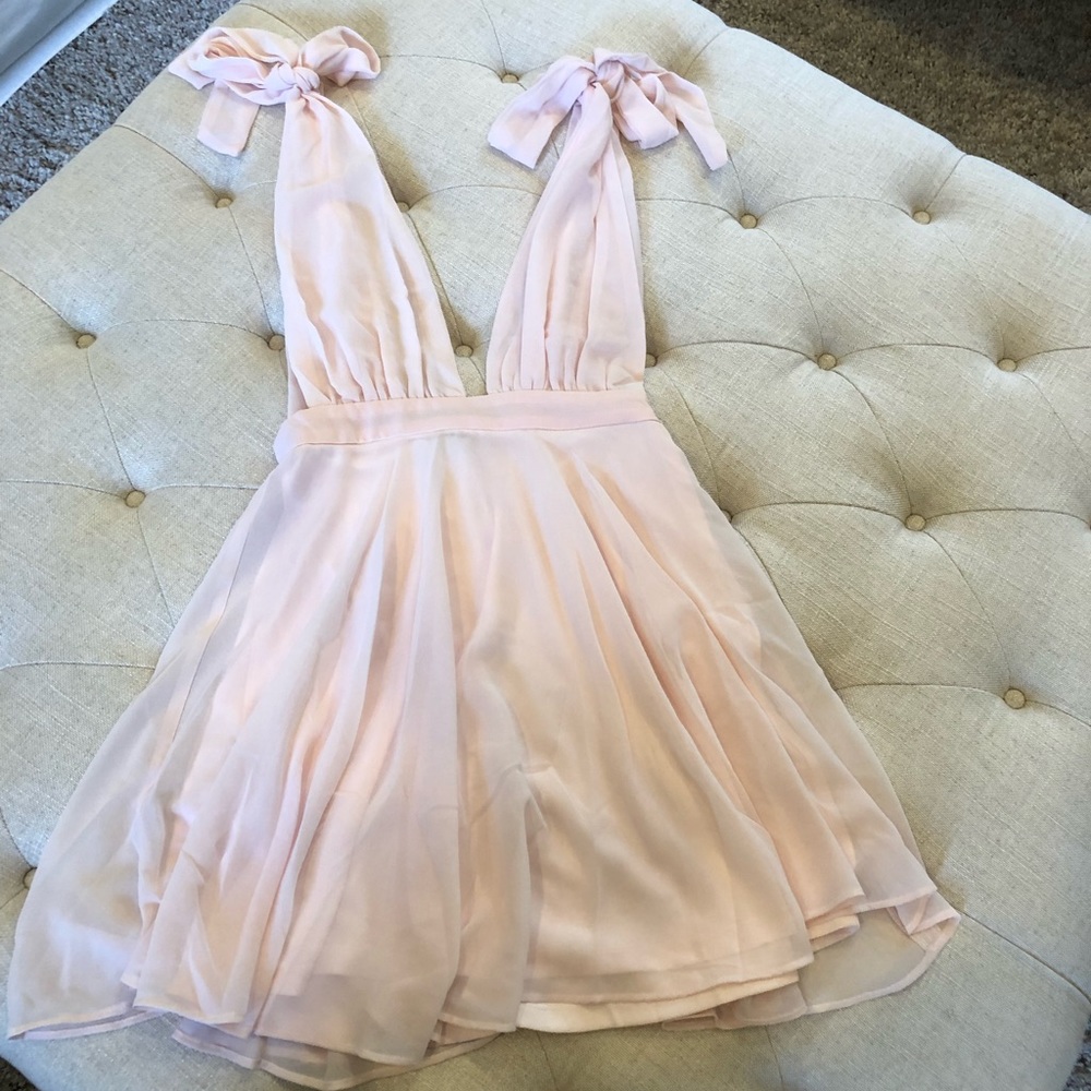 New with tags.  Light pink summer sexy dress